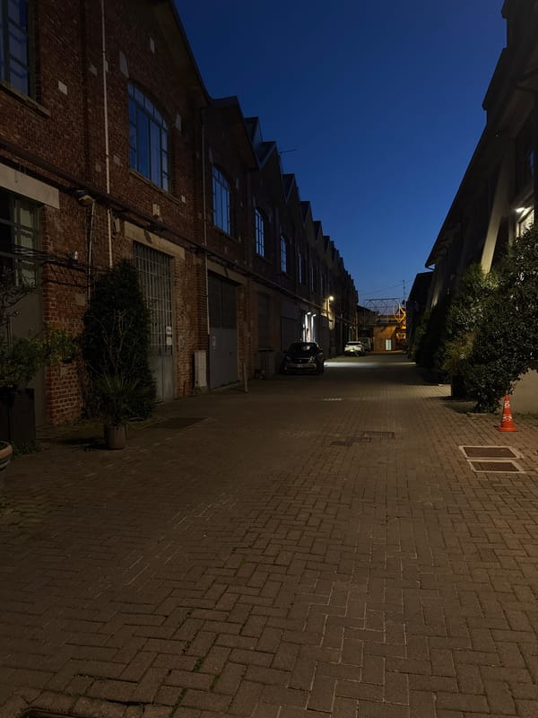 Evening snapshots capture everyday Milan moments: food, streets, scooter