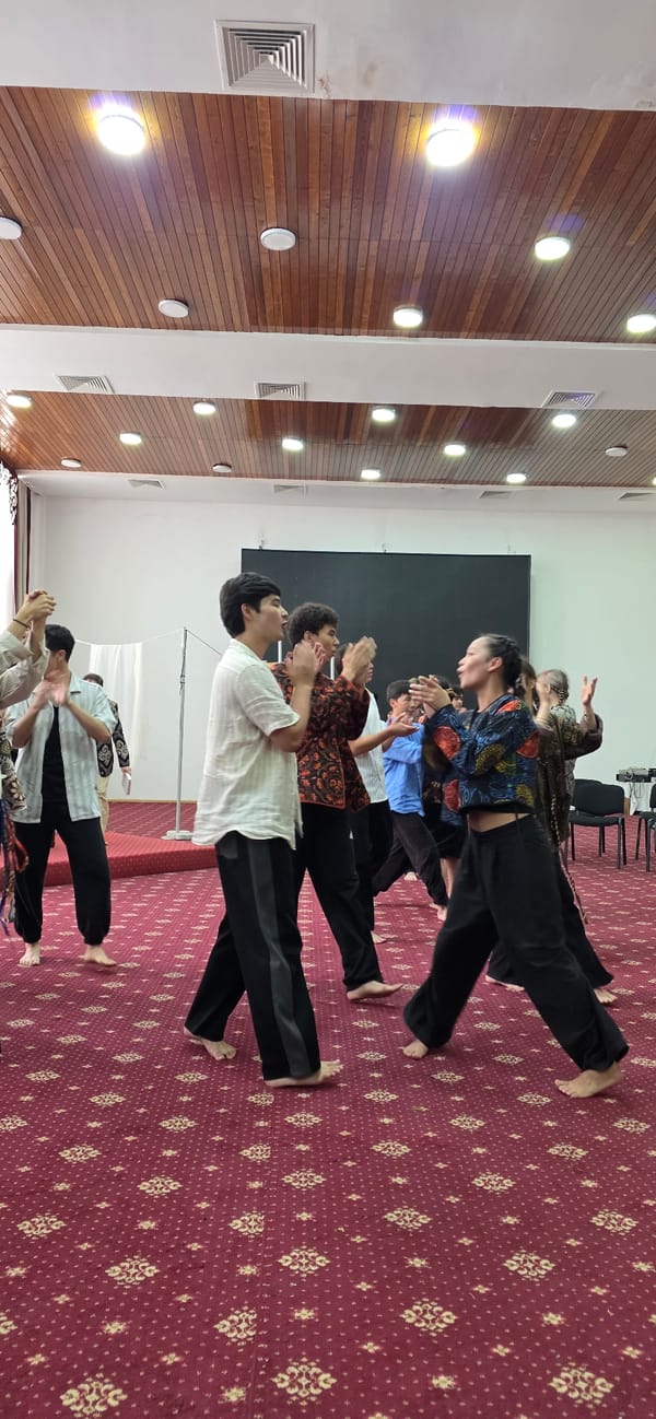 Performance rehearsal underway in a community hall, Bulan-Segettu
