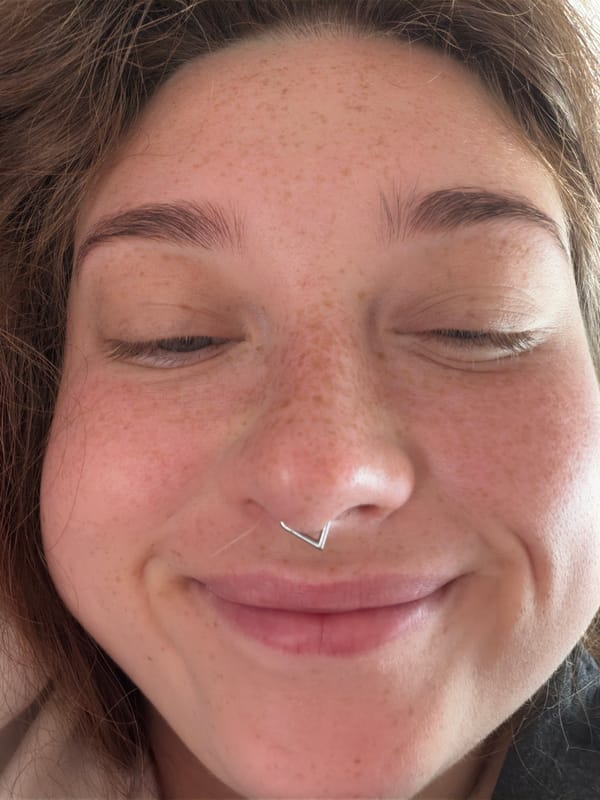 Close-up portrait with closed eyes and a quiet smile, Stryi