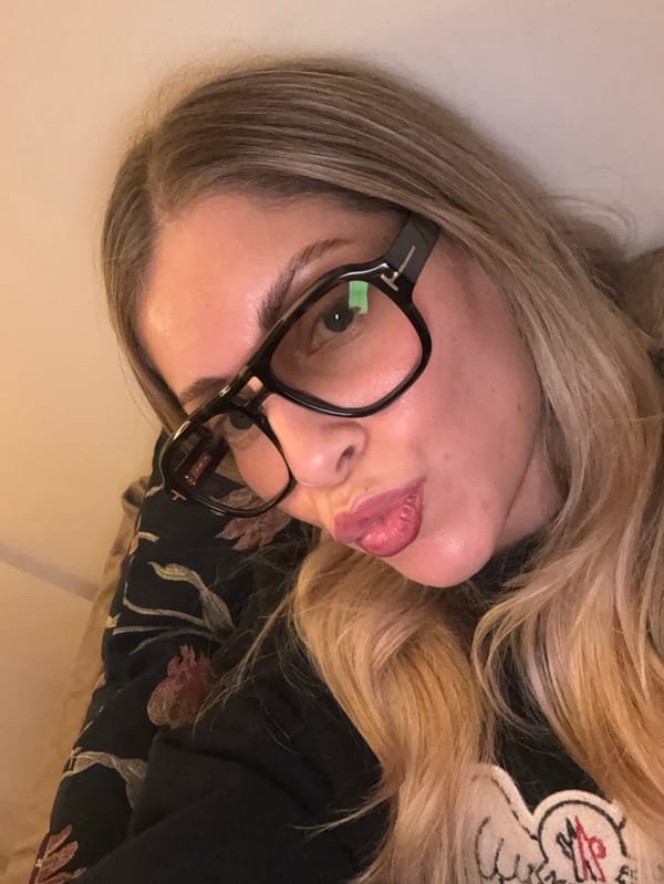 Woman documents evening selfie session in Paris apartment