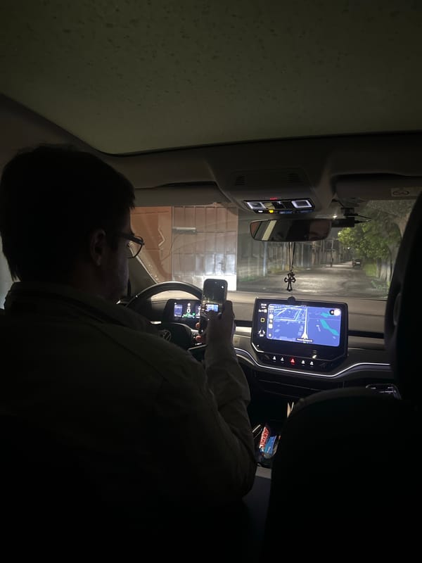 Driver uses phone in car on Yerevan street