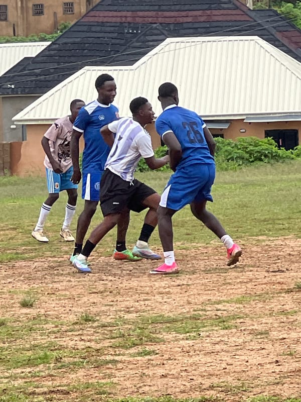 Pickup soccer on a dusty field in Jos, Nigeria