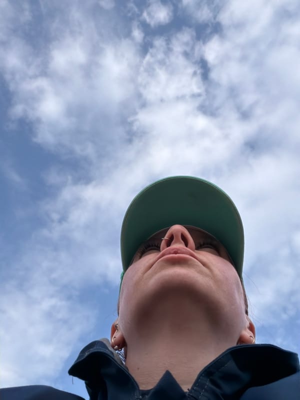 Family enjoys leisurely afternoon gardening with bull terrier in Chaikovsky