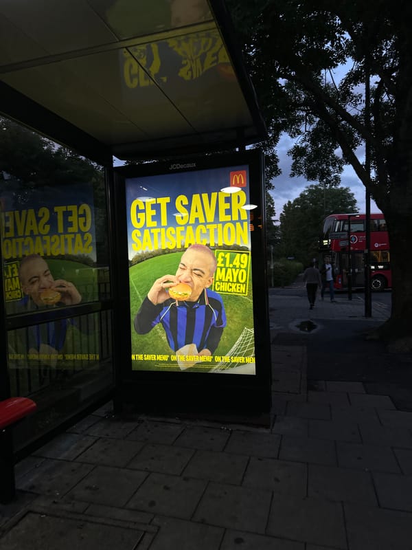 McDonald's ad glows in London bus shelter at dusk