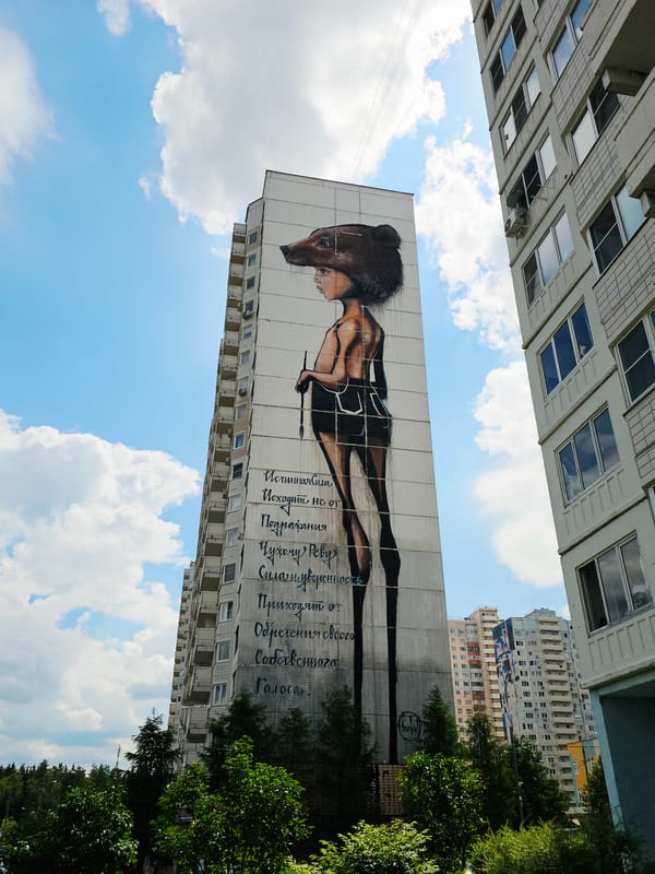 Bear-headed figure mural on Odintsovo residential building