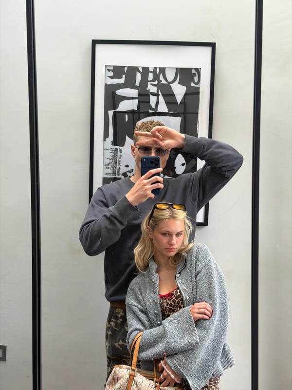 Woman takes mirror selfie in mixed pattern outfit, London