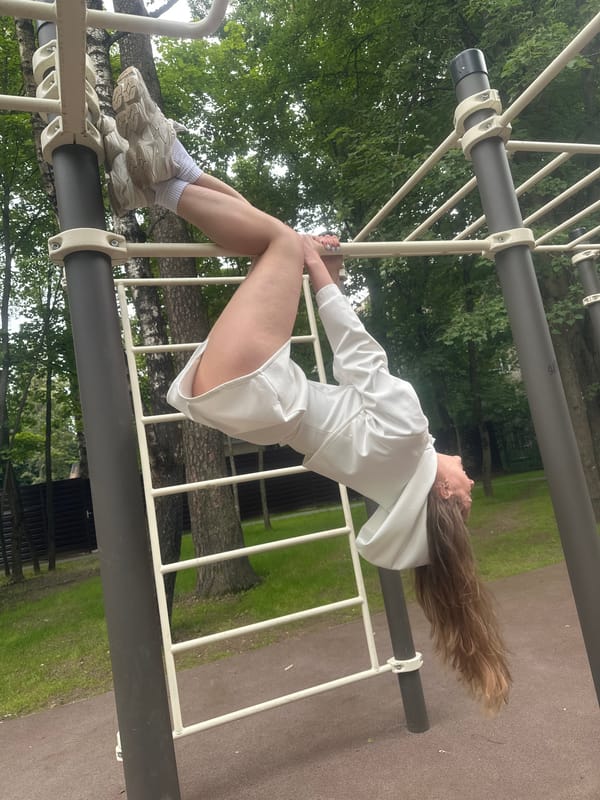 Gymnastic session on outdoor bars in Khimki park