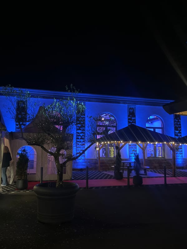 Building illuminated with colorful lights in Saarbrücken nighttime display