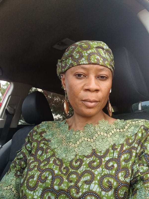 Woman in traditional dress observed in car, Rigachikun Nigeria