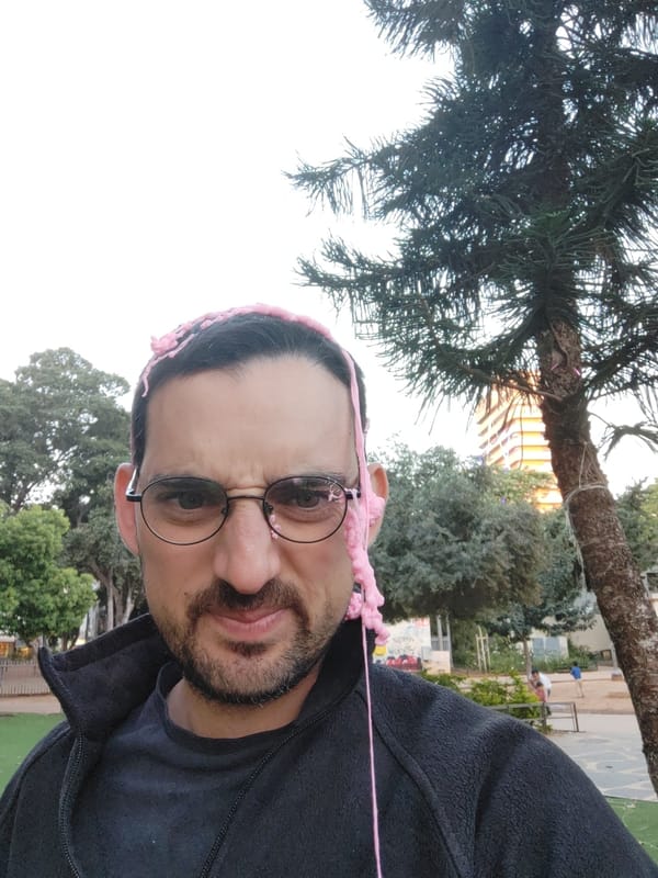 Man plays with pink slime outdoors in Tel Aviv