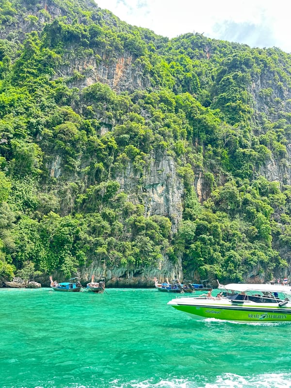 Longtails and speedboats in Maya Bay's turquoise waters