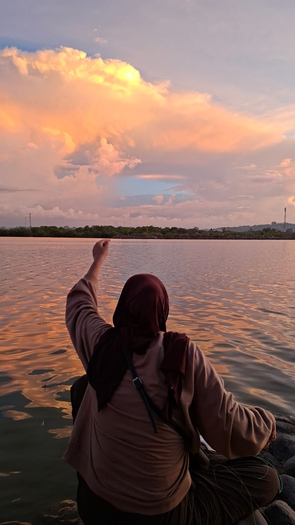 Sunset at the Lhokseumawe waterfront — fishing, relaxing, golden skies