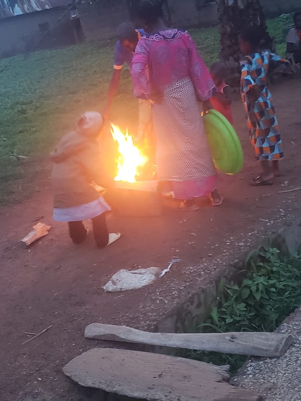 Community gathers around bonfire in Gumel, Nigeria