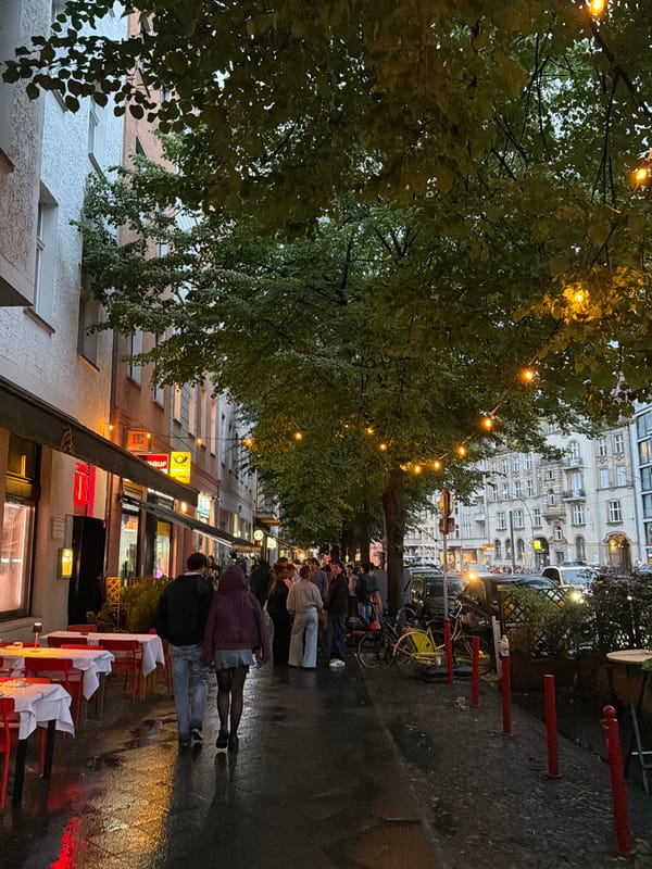 Berlin evening: wet streets, classic architecture, and a live performance