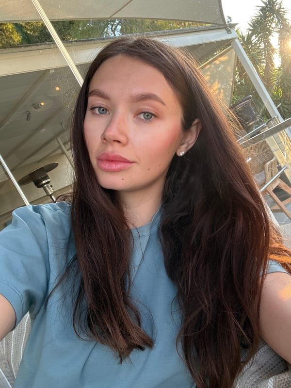 Woman photographed at cafe in Vouliagmeni, Greece