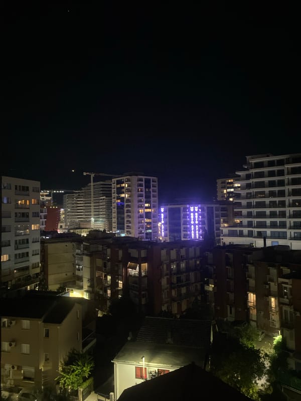 Gamer multitasks Dota 2 and poker in nighttime Budva
