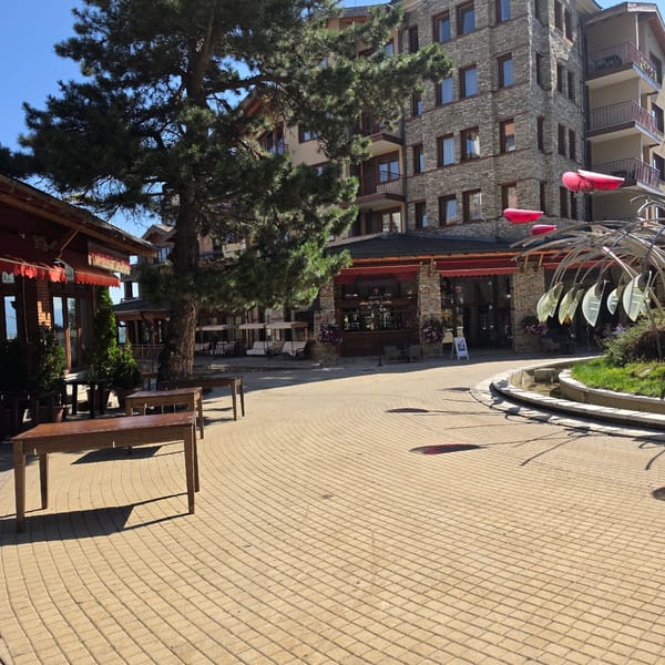 Sunny morning at Razlog resort area with fountain sculpture