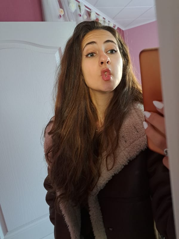 Woman takes selfies indoors in Chepintsi, Bulgaria