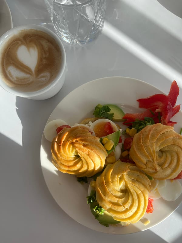 Breakfast meal with stuffed cream puffs photographed in Germany