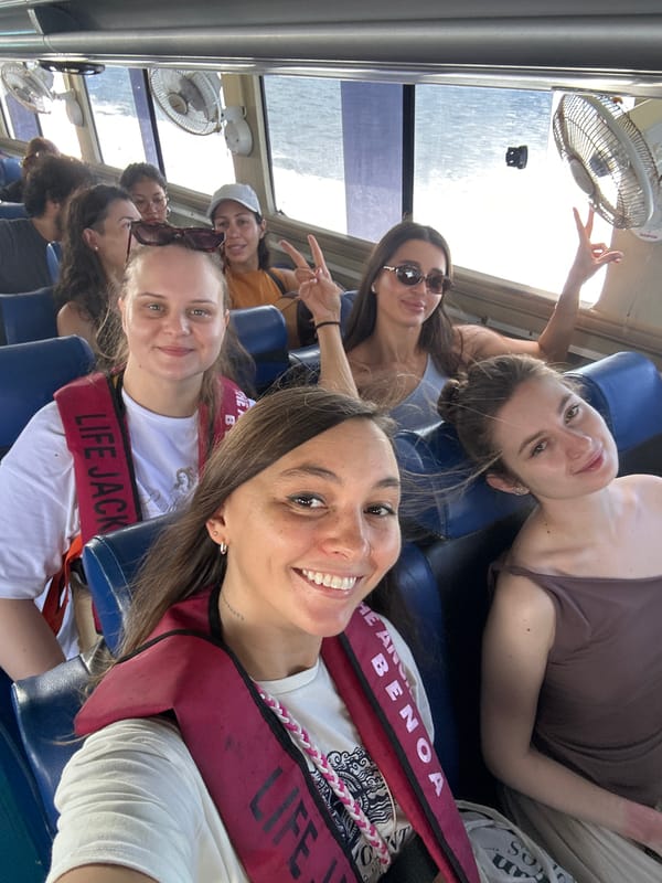 Tourist group poses for photos during Indonesian boat excursion