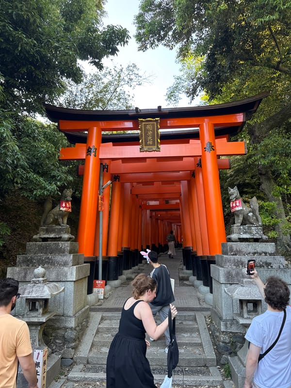 Morning visitors explore iconic Fushimi Inari shrine in Kyoto