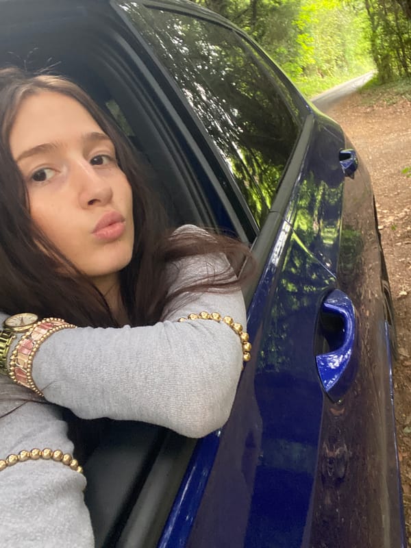 Young couple photographed with blue car in Upper Basildon