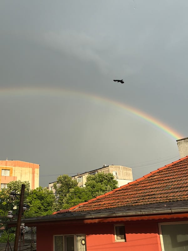 Rainbow appears over Kardzhali street amid cloudy skies