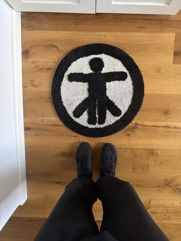Person naps with decorative sleep mask and dog pillow