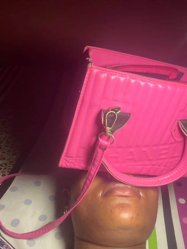 Evening moments with pink handbag and takeout meal in Ado