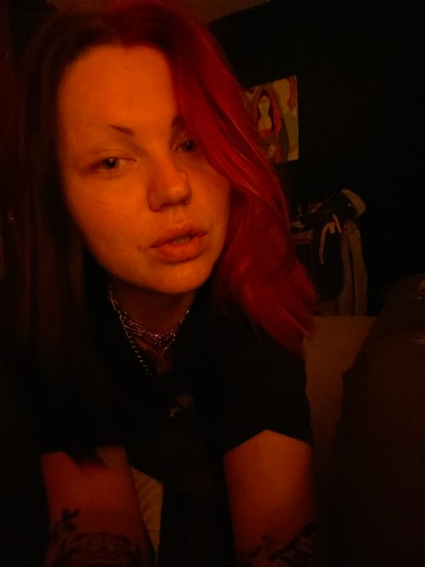 Person with red hair photographed sleeping in Kunje, Montenegro