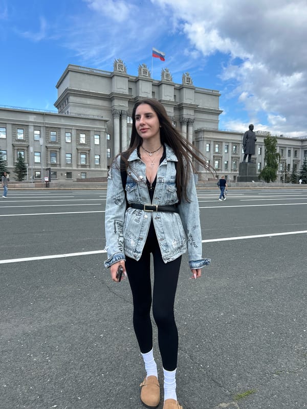 Posing outside a neoclassical landmark in Novokuybyshevsk