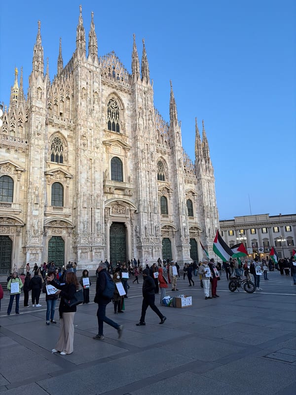 Evening crowds gather in Milan's historic Piazza del Duomo