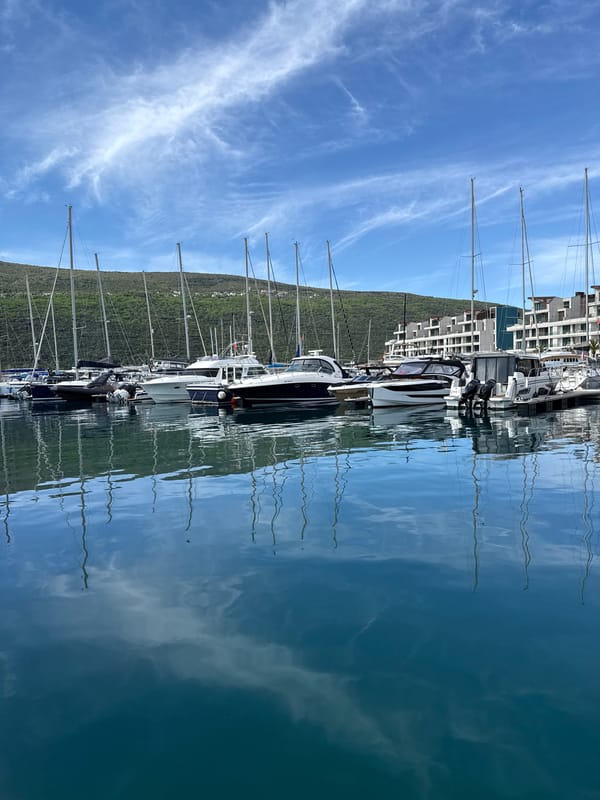 Woman documents marina visit in Đenovići, Montenegro