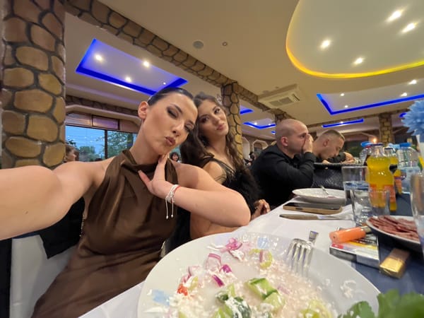 Two women take angled selfie at Bulgarian restaurant