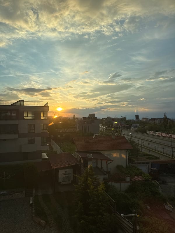Sunset cityscape with highway captured at unknown location