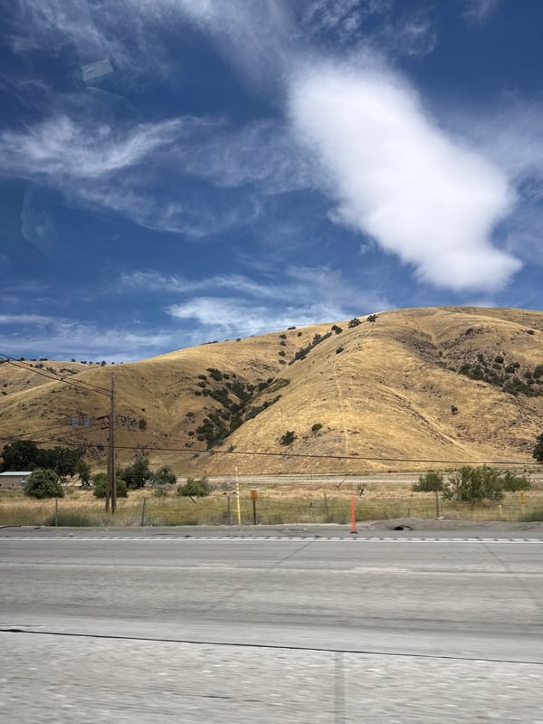 Highway drive through dry golden hills near Lebec, California