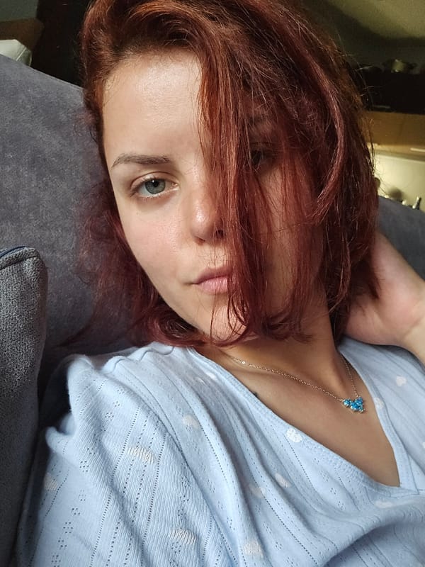Two angles of a person resting on a grey couch