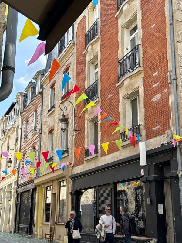 Festive bunting decorates street scene in Reims, France