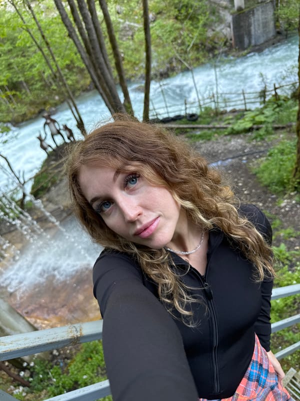 Tourists photograph themselves at Abkhazia waterfall and dam site