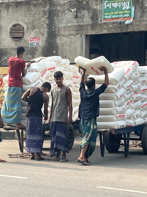 Daily street commerce and pedestrian activity documented in Dhaka