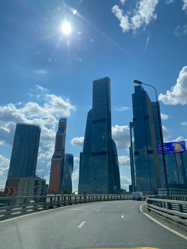 Elevated highway curves under clear skies outside Moscow