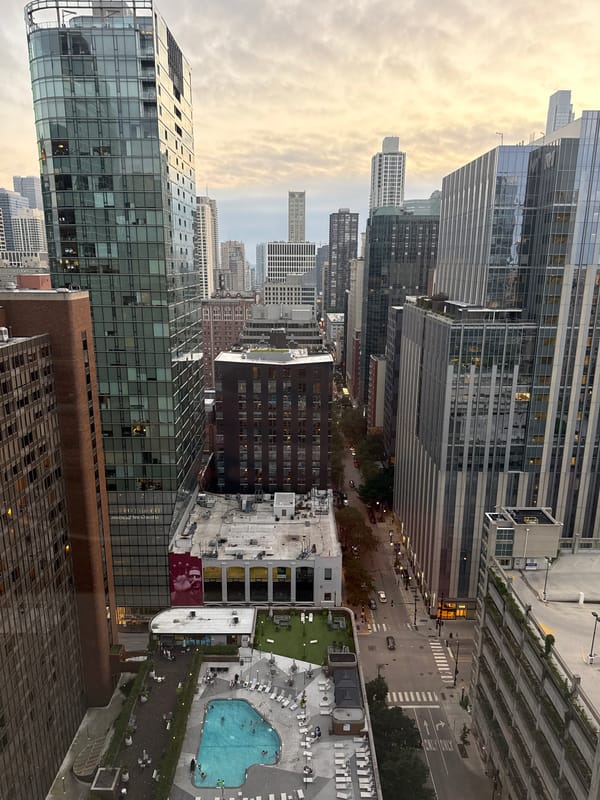 Chicago rooftop pool and skyline at dusk, July 2026