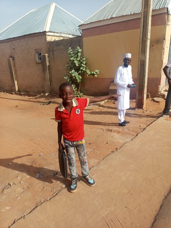Children walk residential street in Tempure, Nigeria