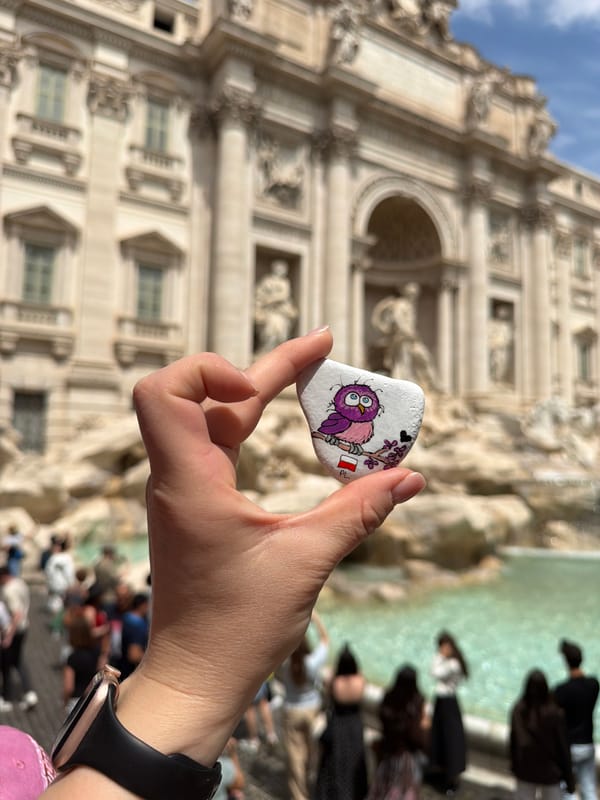 Tourist captures multiple photos at Trevi Fountain in Rome