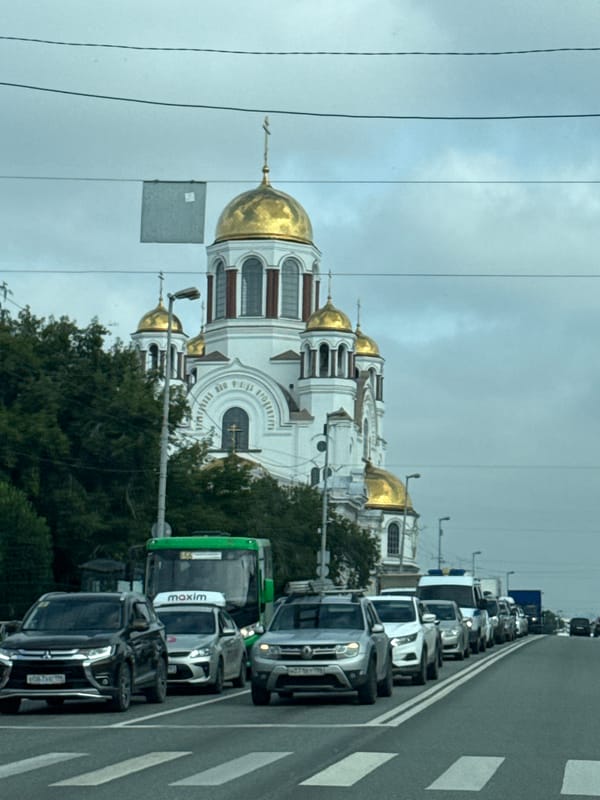 Traffic stop in Yekaterinburg with a golden-domed church in view