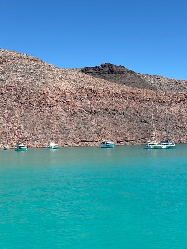 Evening boating activity observed along Mexico's rocky turquoise coastline