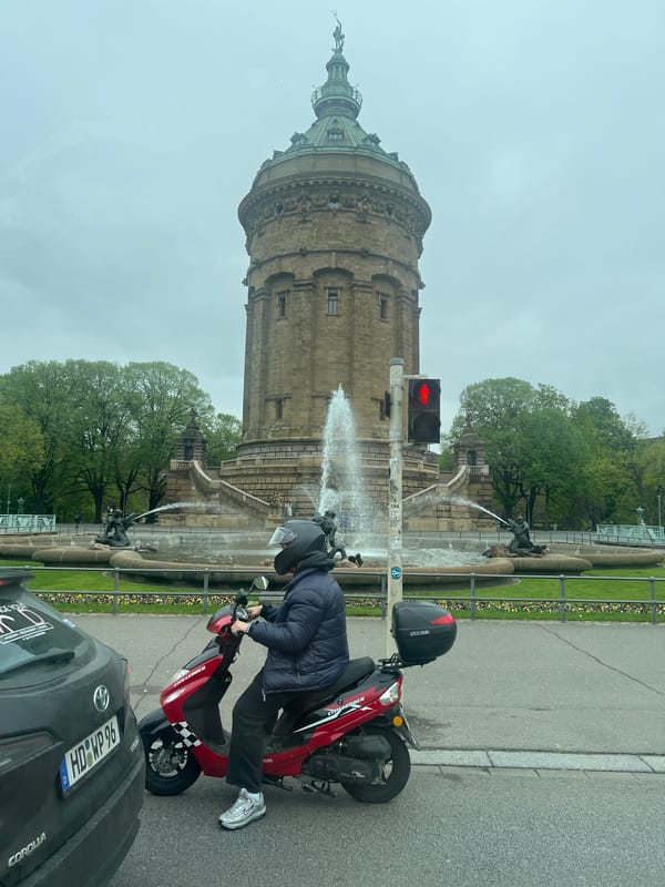 Everyday life continues around Mannheim's historic water tower