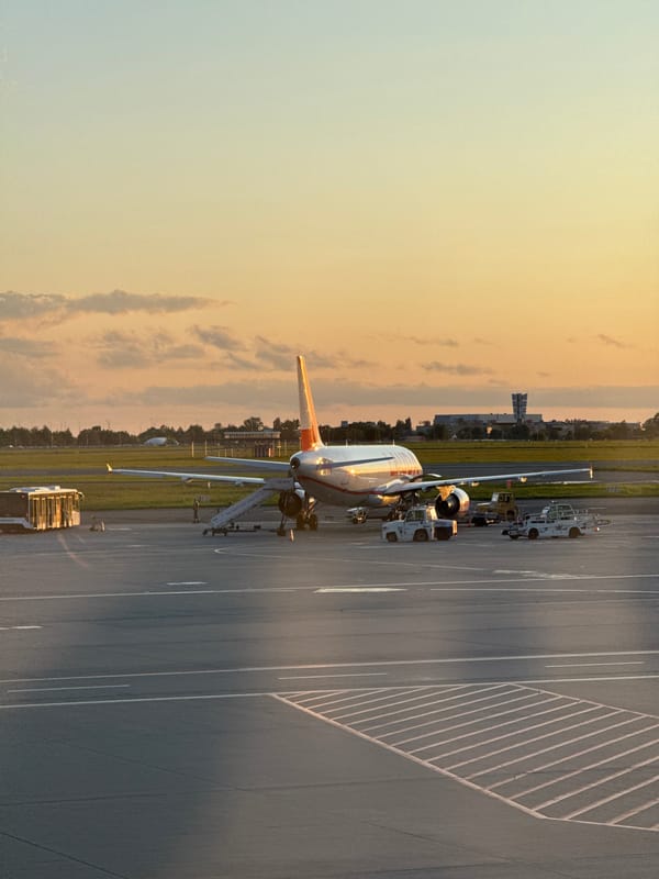 Orange and white A320 on the tarmac at Warsaw airport