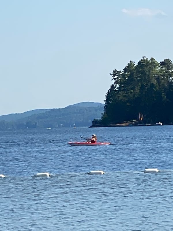 Kayaking a clear, calm lake near Duhamel on a sunny afternoon