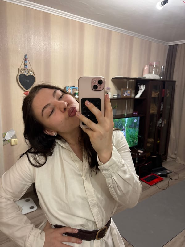 Woman Takes Kissing Selfie in Mirror in Perm